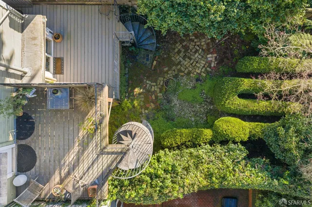 an aerial view of a house with parking space