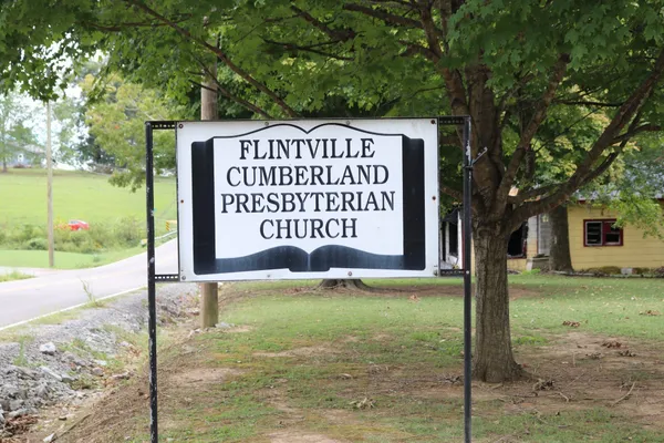 a sign on the side of the road