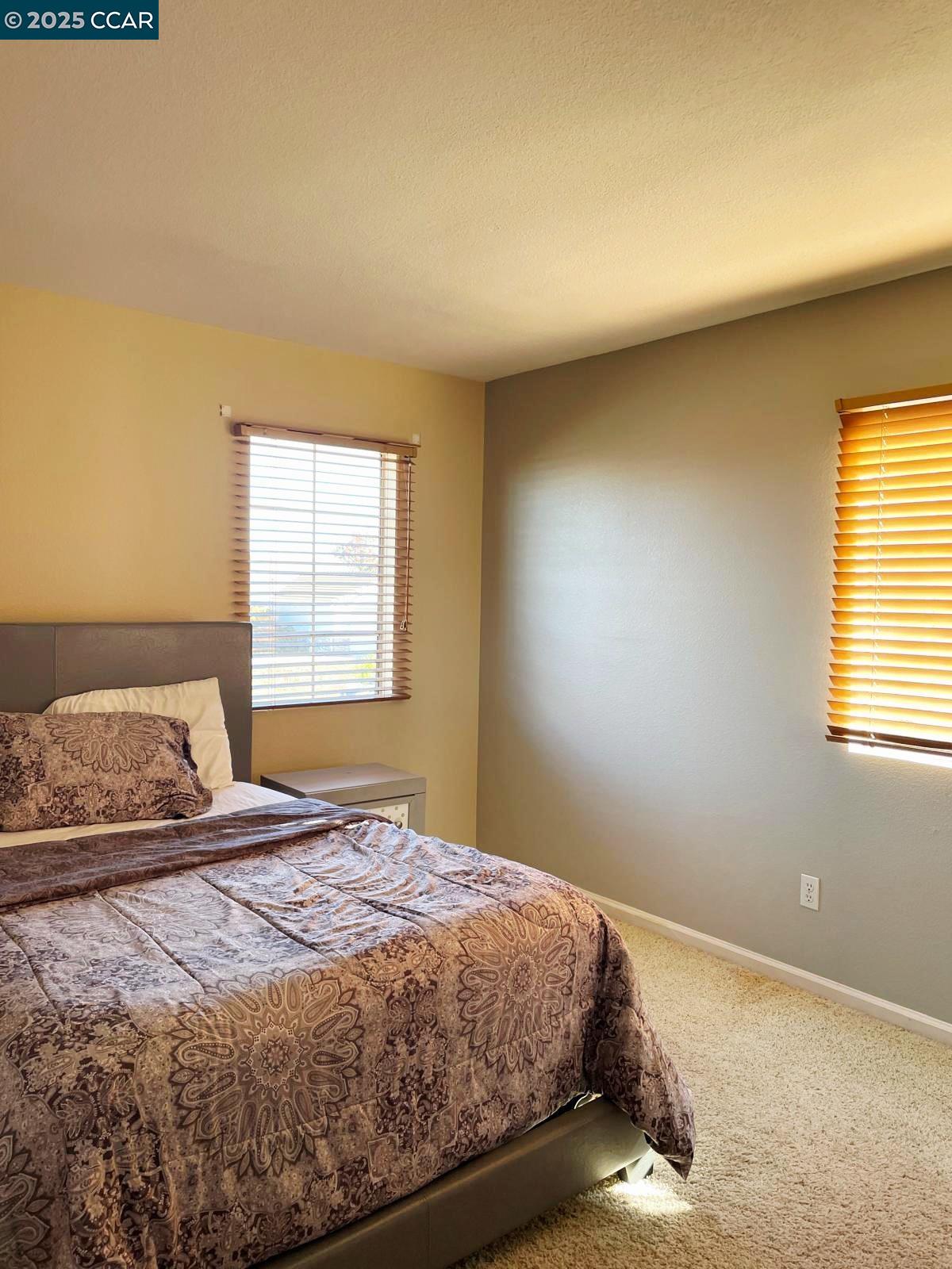 5224 Cedar Ridge Way Antioch, CA 94531 - Photo 3 of 5 a bedroom with a bed and a window