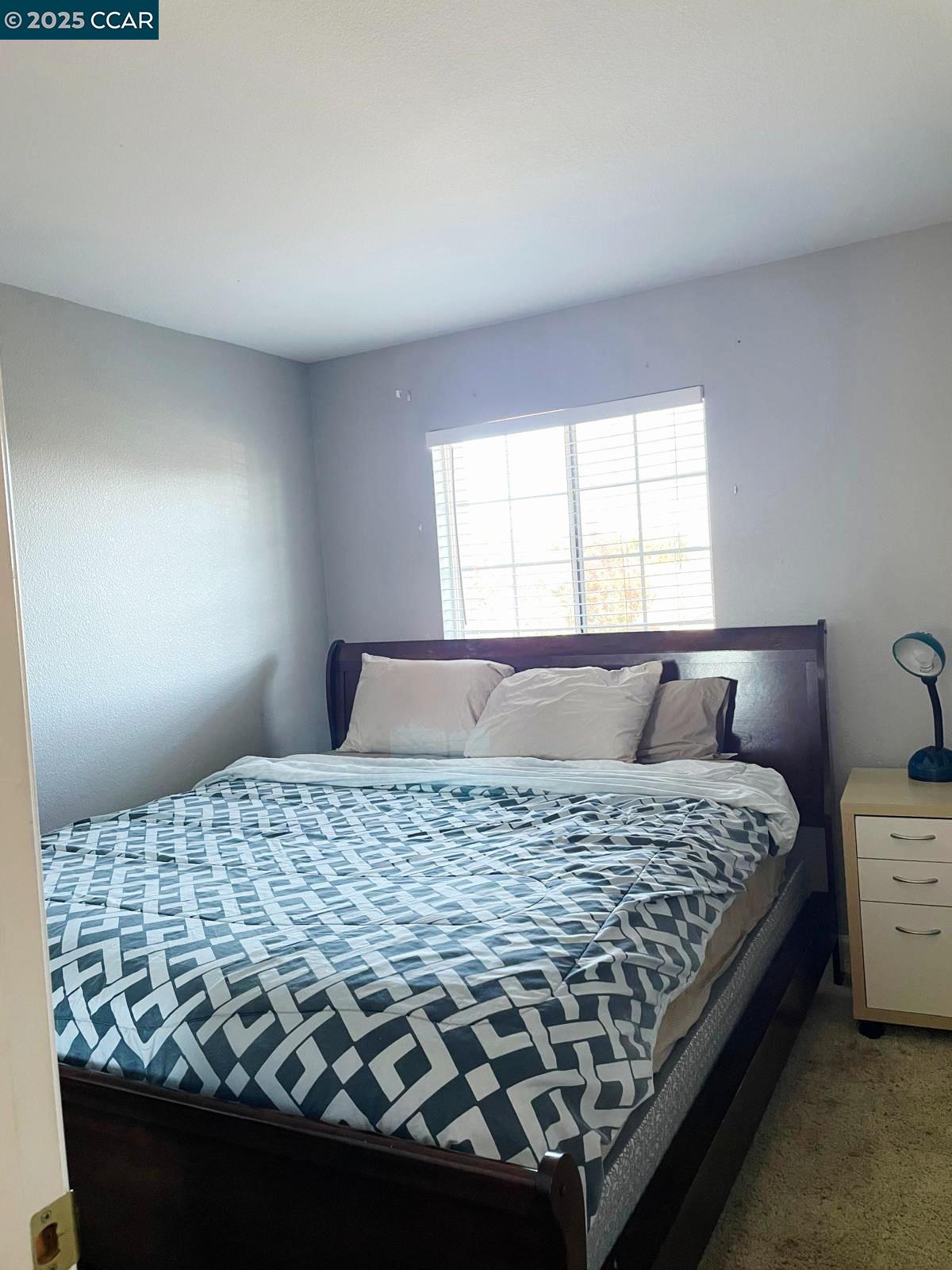 5224 Cedar Ridge Way Antioch, CA 94531 - Photo 4 of 5 a bedroom with a bed and a window