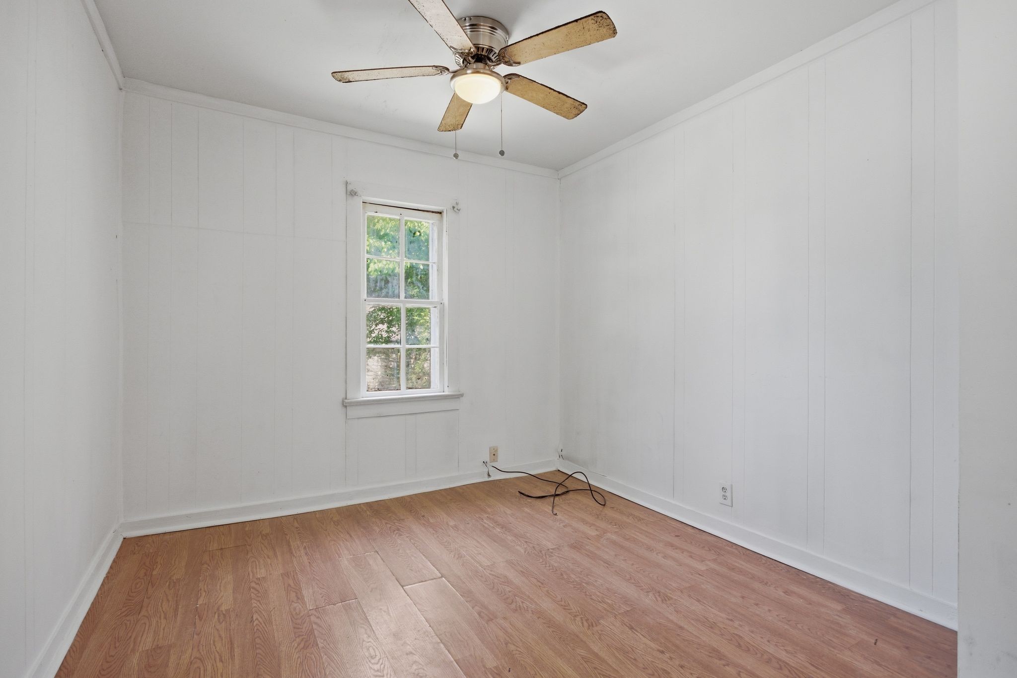 433 Jones Street Pulaski, TN 38478 - Photo 10 of 25 wooden floor in an empty room with a window
