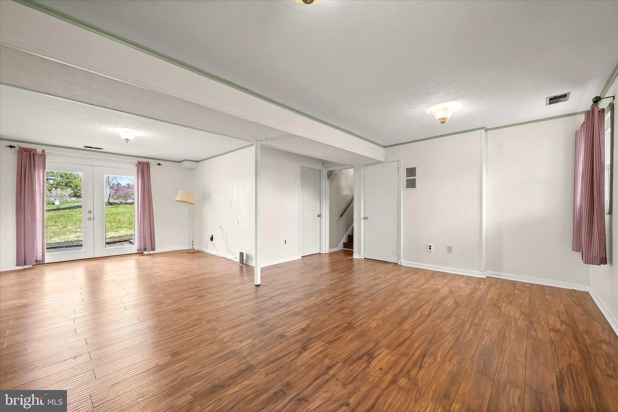 14821 Ridge Oak Drive Boyds, MD 20841 - Photo 31 of 49 a view of an empty room with wooden floor and window