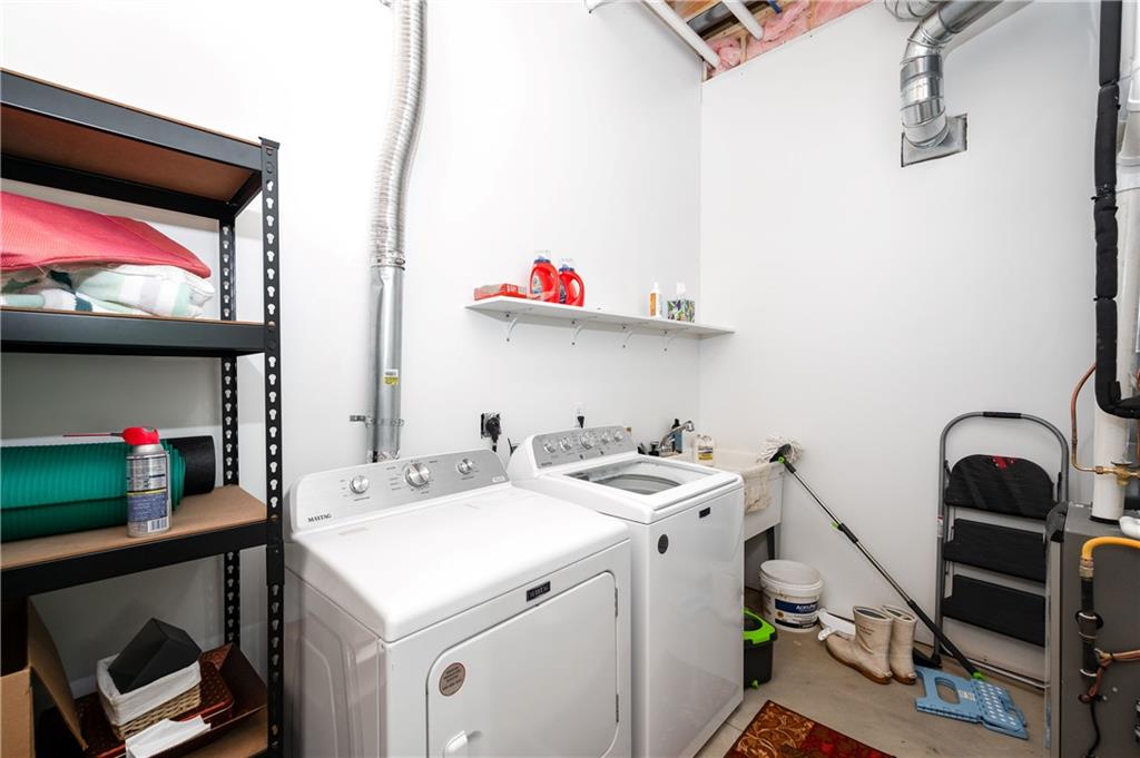 162 East Maple Lane Clarion, PA 16214 - Photo 33 of 49 a utility room with dryer washer and a view of living room