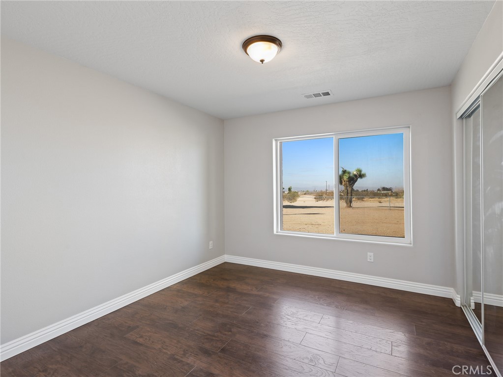 7755 7th Street Phelan, CA 92371 - Photo 14 of 27 an empty room with a window