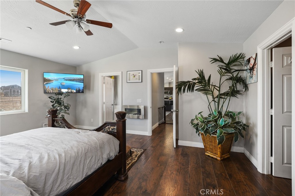 7755 7th Street Phelan, CA 92371 - Photo 17 of 27 a bed room with furniture and a potted plant