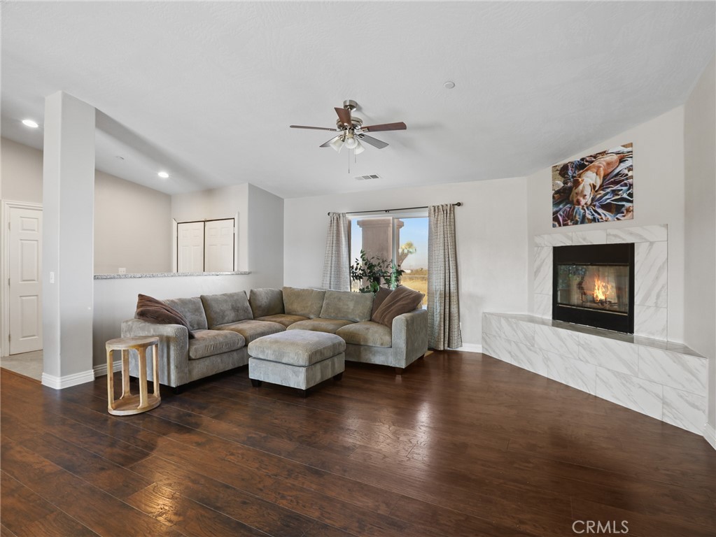 7755 7th Street Phelan, CA 92371 - Photo 2 of 27 a living room with furniture and a fireplace