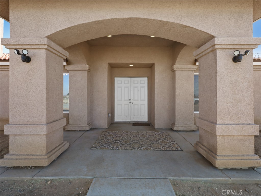 7755 7th Street Phelan, CA 92371 - Photo 22 of 27 a view of a big room with closet and windows