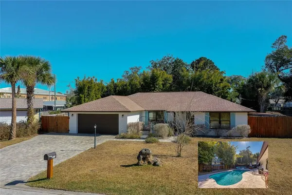 a house with swimming pool in front of it