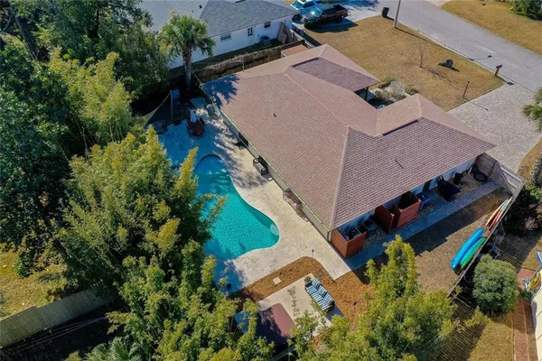 an aerial view of house with yard