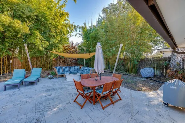 a view of a house with wooden fence
