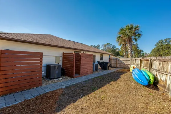 an aerial view of a house with outdoor space