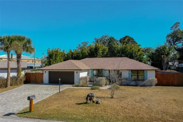 a utility room with fridge dryer and washer