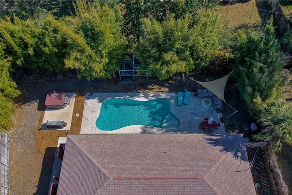 an aerial view of a house with outdoor space