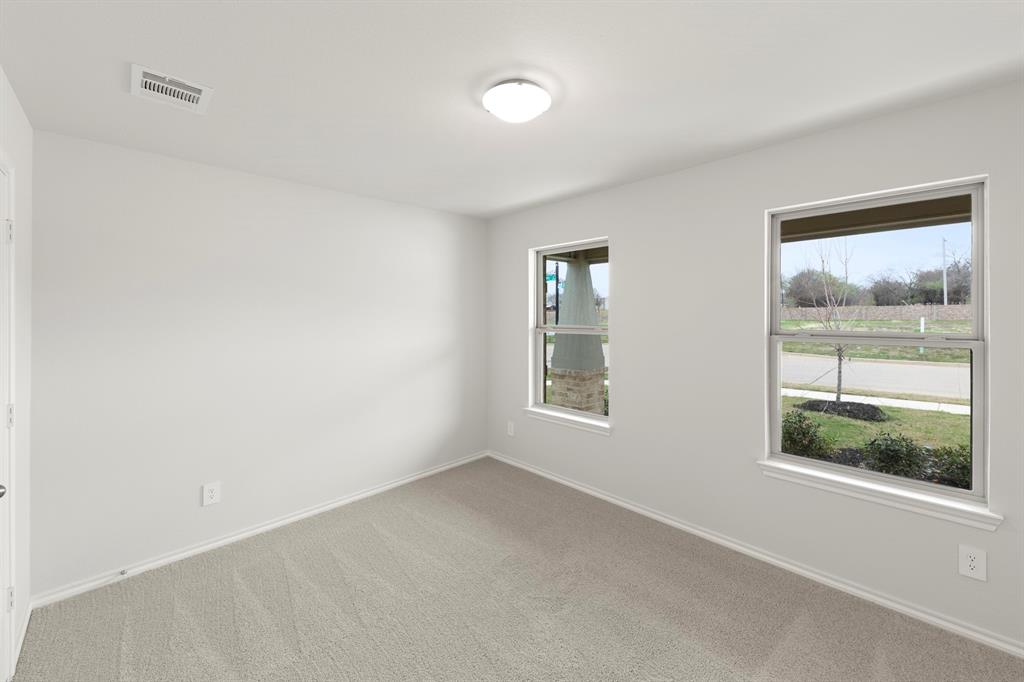1120 Rushing Court Aubrey, TX 76227 - Photo 15 of 27 an empty room with windows