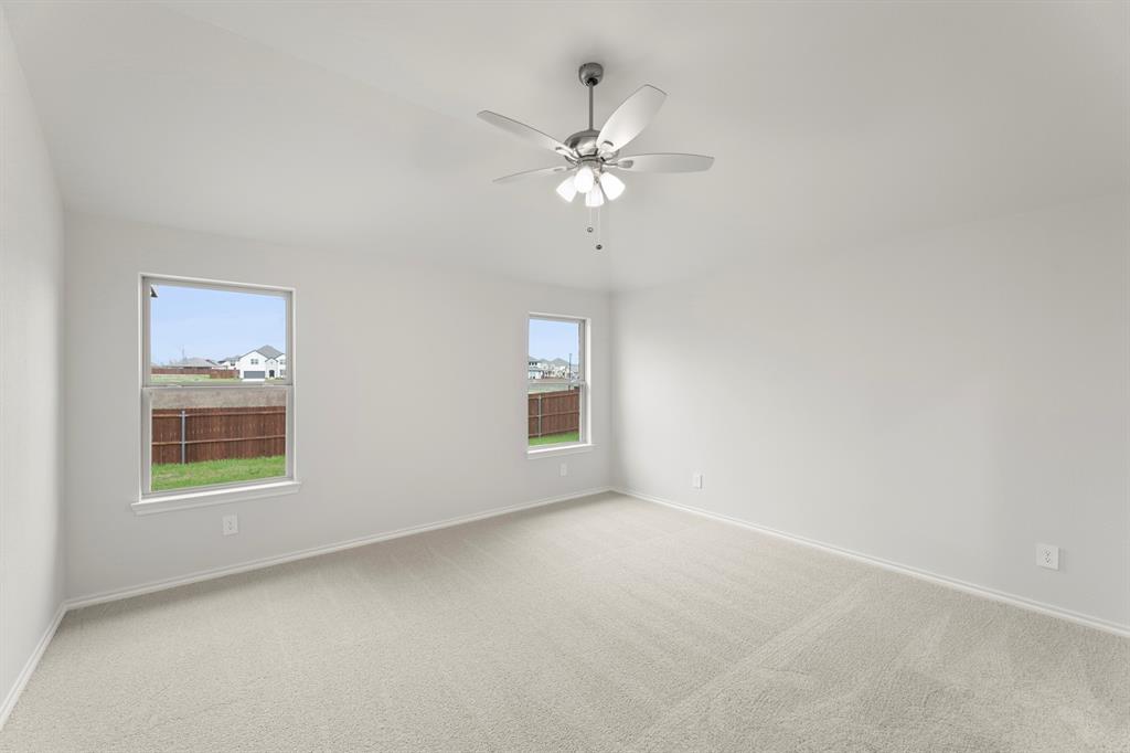 1120 Rushing Court Aubrey, TX 76227 - Photo 18 of 27 an empty room with a window and a fan