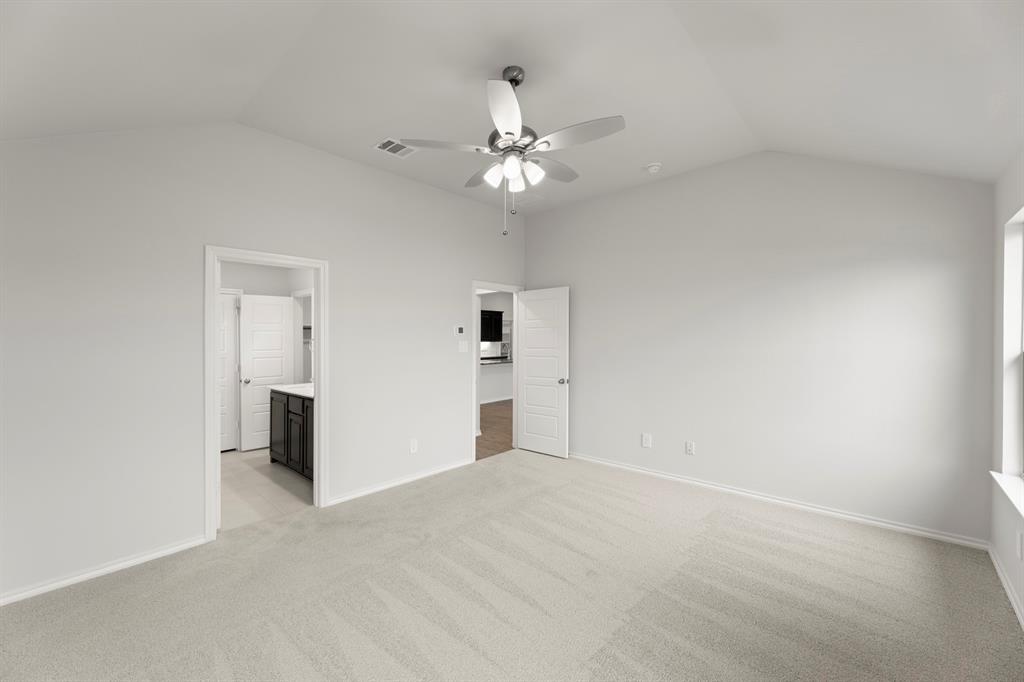 1120 Rushing Court Aubrey, TX 76227 - Photo 19 of 27 an empty room with closet and a ceiling fan