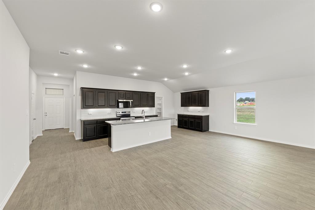 1120 Rushing Court Aubrey, TX 76227 - Photo 10 of 27 a view of kitchen with kitchen island sink and stove