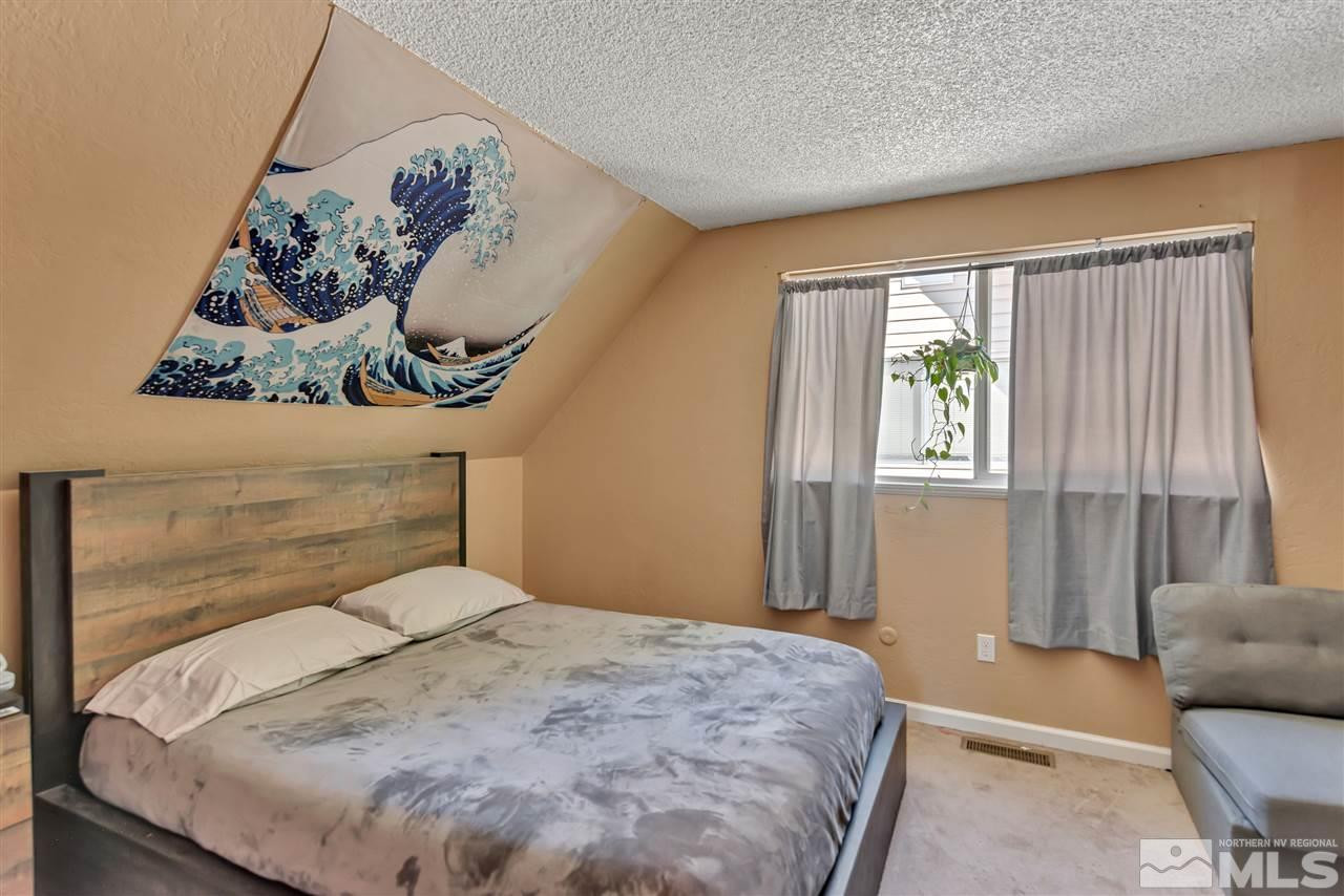 32 Gault Way Sparks, NV 89431 - Photo 19 of 26 a bedroom with a bed and a window