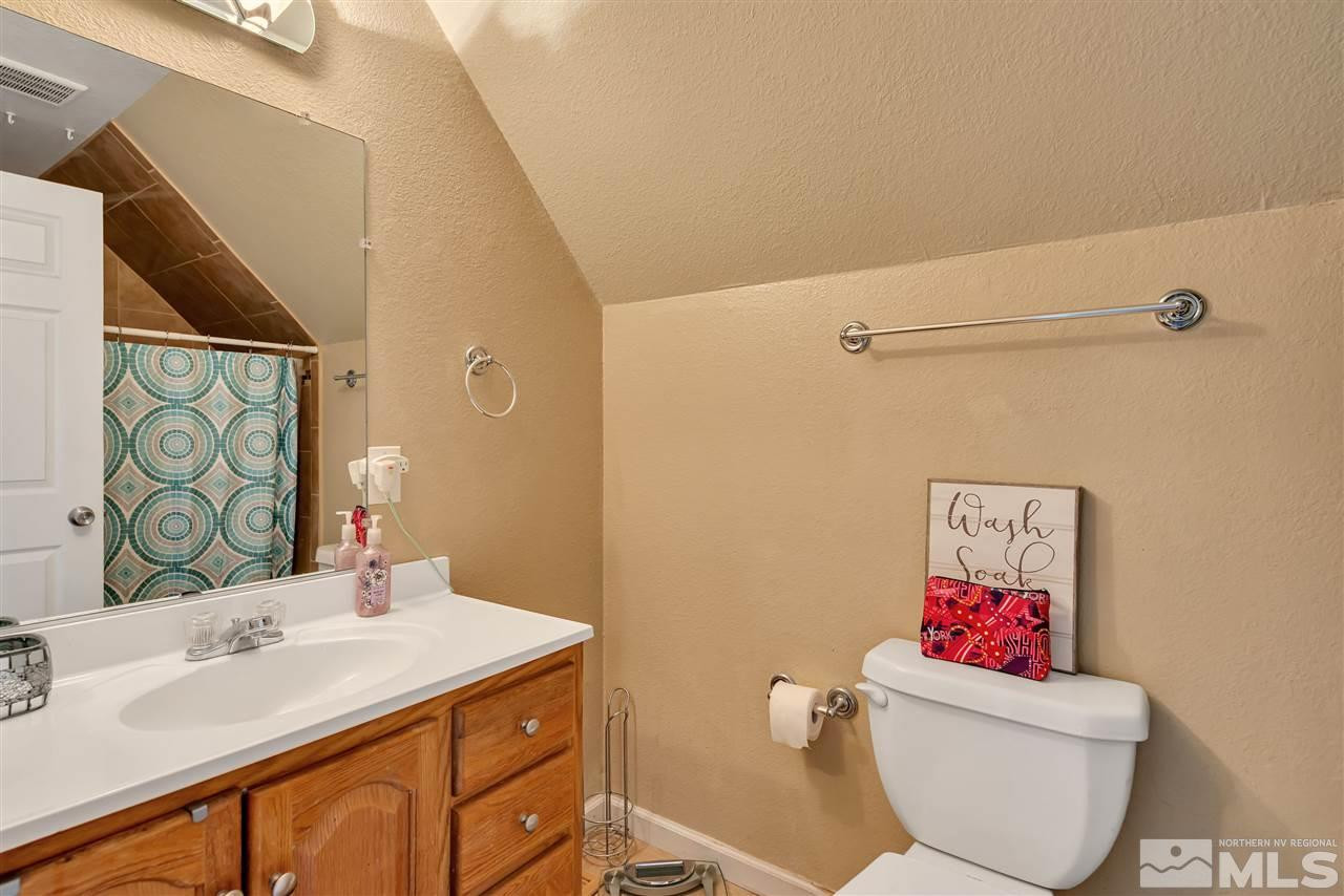 32 Gault Way Sparks, NV 89431 - Photo 21 of 26 a bathroom with a sink toilet and shower