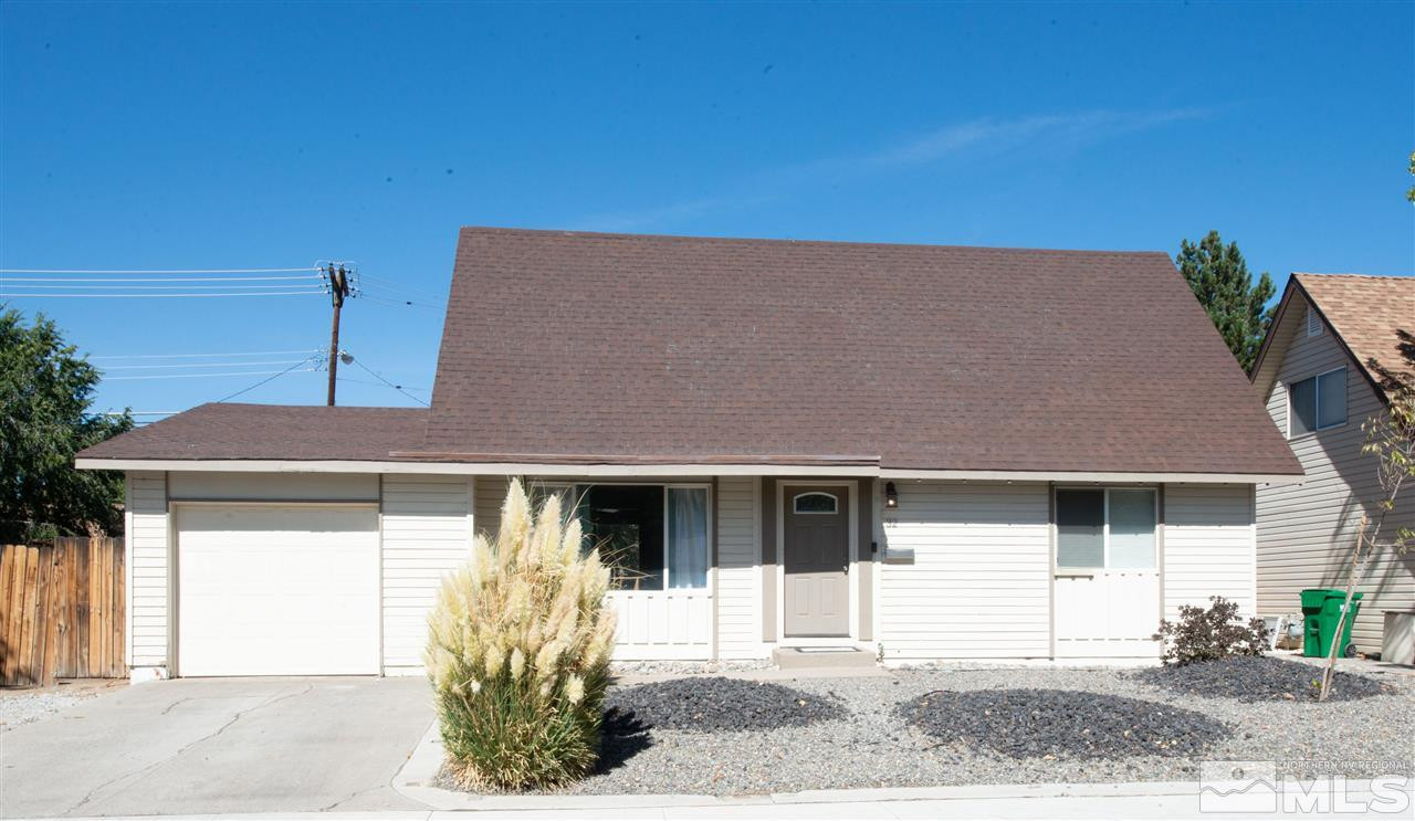 32 Gault Way Sparks, NV 89431 - Photo 3 of 26 a front view of a house with a yard