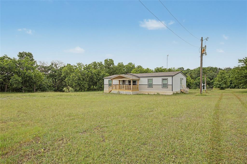 6065 Timber Trail Azle, TX 76020 - Photo 33 of 33 a front view of a house with a big yard