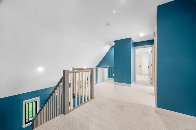 a view of a hallway with staircase