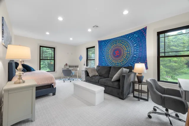 a living room with furniture and a large window