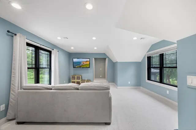 a living room with furniture and windows