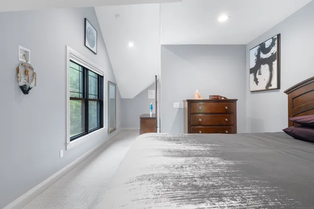 a view of a livingroom with an empty space and a fireplace