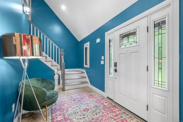 a view of entryway with a front door