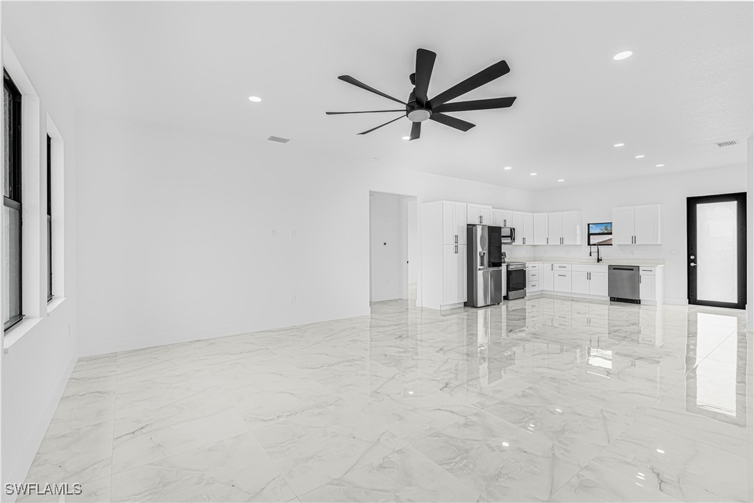 9007 East Crow Circle LaBelle, FL 33935 - Photo 11 of 46 a view of a livingroom with a ceiling fan