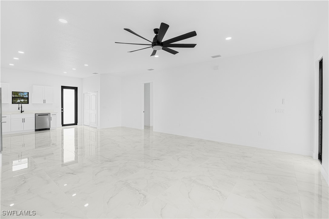 9007 East Crow Circle LaBelle, FL 33935 - Photo 12 of 46 a view of a livingroom with a ceiling fan and window