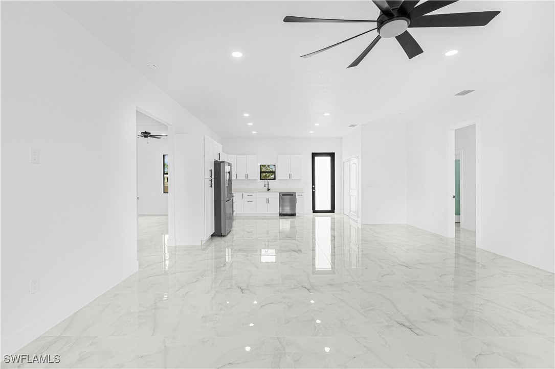 9007 East Crow Circle LaBelle, FL 33935 - Photo 20 of 46 a view of a livingroom with a ceiling fan and window
