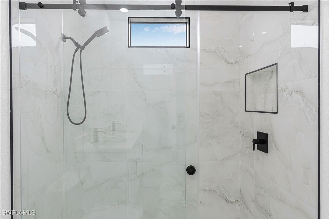 9007 East Crow Circle LaBelle, FL 33935 - Photo 29 of 46 a bathroom with a shower