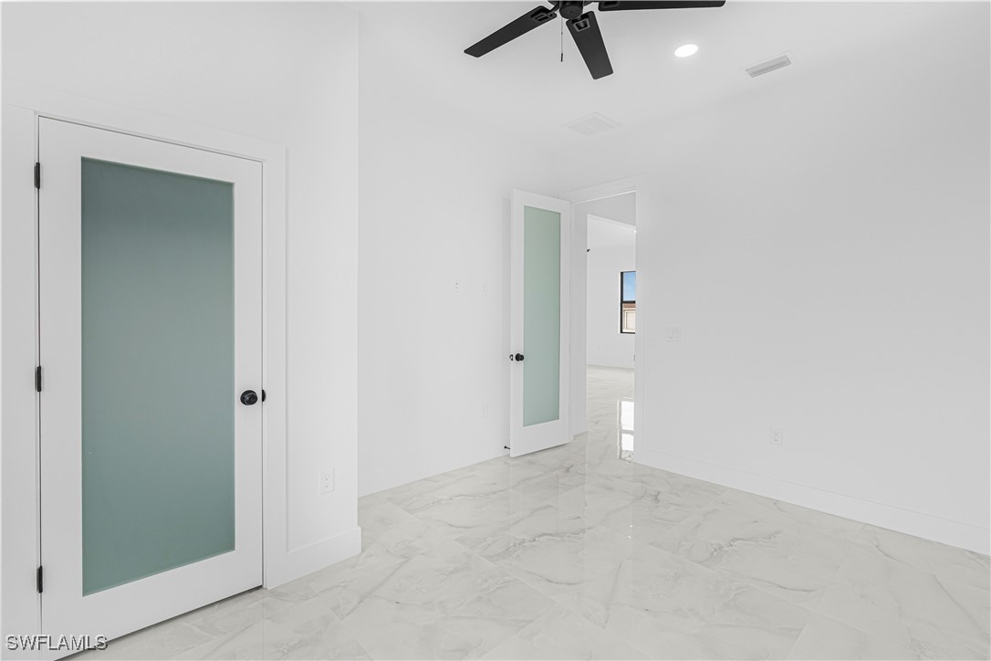 9007 East Crow Circle LaBelle, FL 33935 - Photo 31 of 46 an empty room with closet and windows