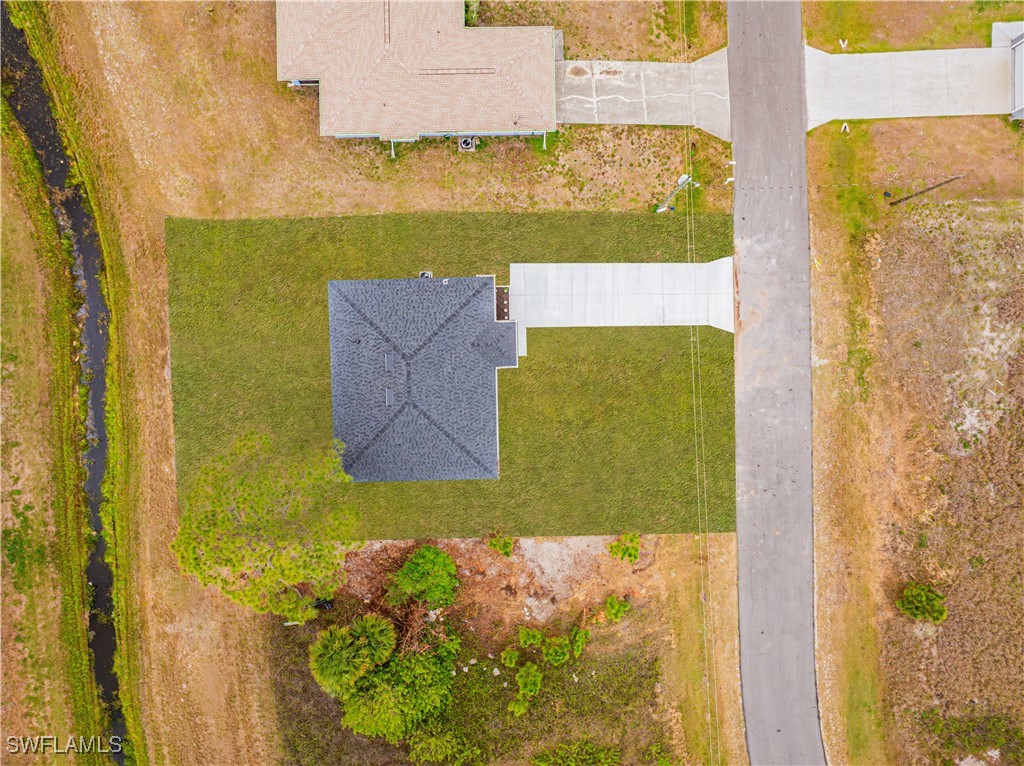 9007 East Crow Circle LaBelle, FL 33935 - Photo 42 of 46 view of a bathroom with a shower curtain