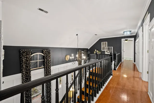 a spacious bathroom with a double vanity sink and a mirror