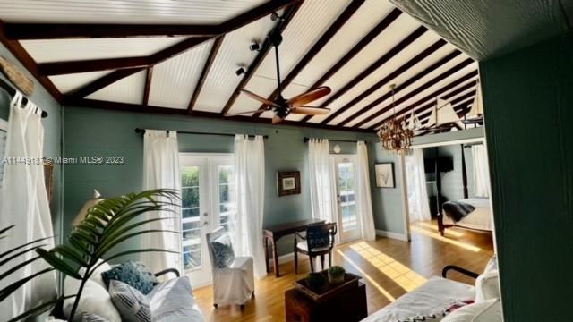 27316 Cayman Lane, Unit A Lower Keys, FL 33042 - Photo 24 of 47 a dining room with furniture and a floor to ceiling window