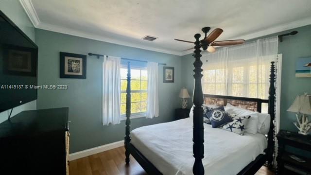 27316 Cayman Lane, Unit A Lower Keys, FL 33042 - Photo 28 of 47 a bedroom with a bed and a window