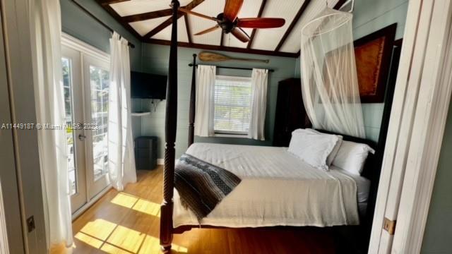 27316 Cayman Lane, Unit A Lower Keys, FL 33042 - Photo 36 of 47 a bedroom with a bed and a mirror