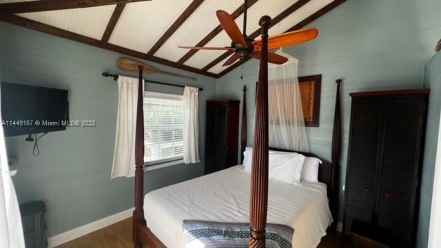 27316 Cayman Lane, Unit A Lower Keys, FL 33042 - Photo 37 of 47 a dining room with furniture and a flat screen tv