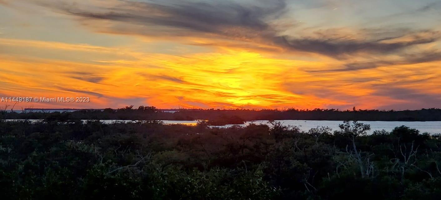 27316 Cayman Lane, Unit A Lower Keys, FL 33042 - Photo 7 of 47 a view of mountain with sunset