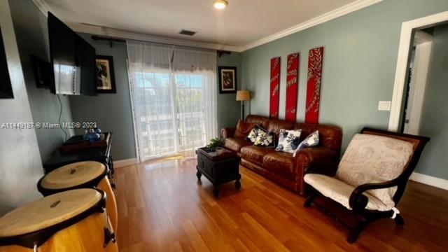 27316 Cayman Lane, Unit A Lower Keys, FL 33042 - Photo 9 of 47 a living room with furniture or couch and a wooden floor