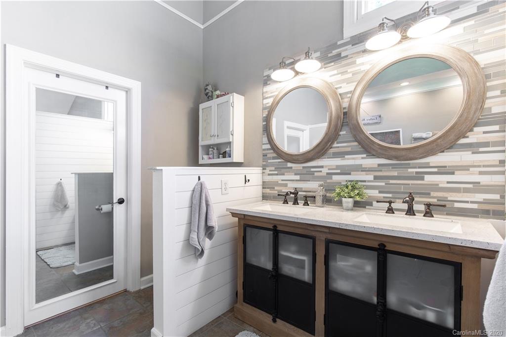 231 Pennington Road Rock Hill, SC 29732 - Photo 19 of 46 a bathroom with a granite countertop sink a mirror and a shower