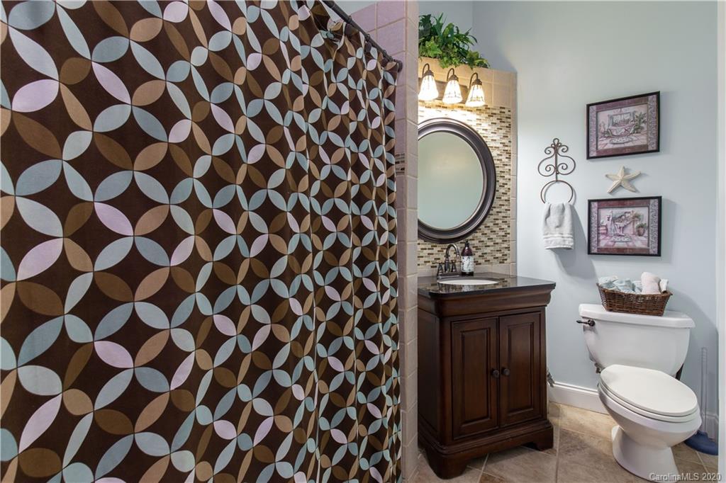 231 Pennington Road Rock Hill, SC 29732 - Photo 21 of 46 a bathroom with a granite countertop toilet and a mirror