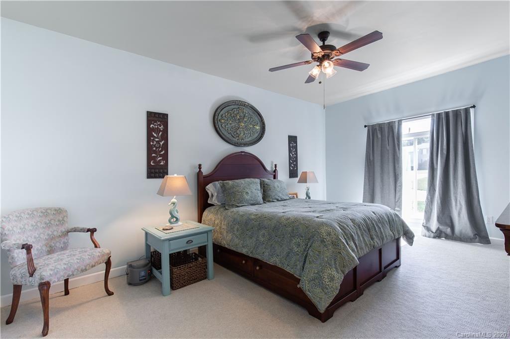 231 Pennington Road Rock Hill, SC 29732 - Photo 24 of 46 a bedroom with a bed and a chandelier