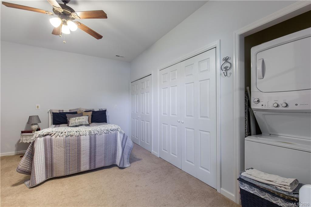 231 Pennington Road Rock Hill, SC 29732 - Photo 29 of 46 a bedroom with a bed and a chandelier