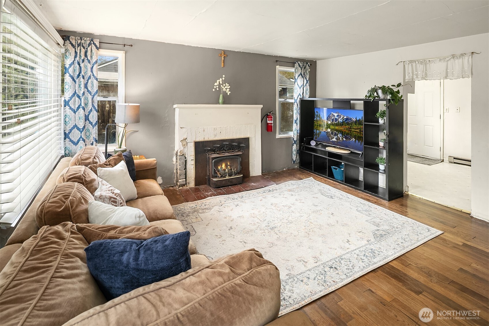 3404 Southeast 5th Street Renton, WA 98058 - Photo 3 of 24 a living room with furniture and a fireplace