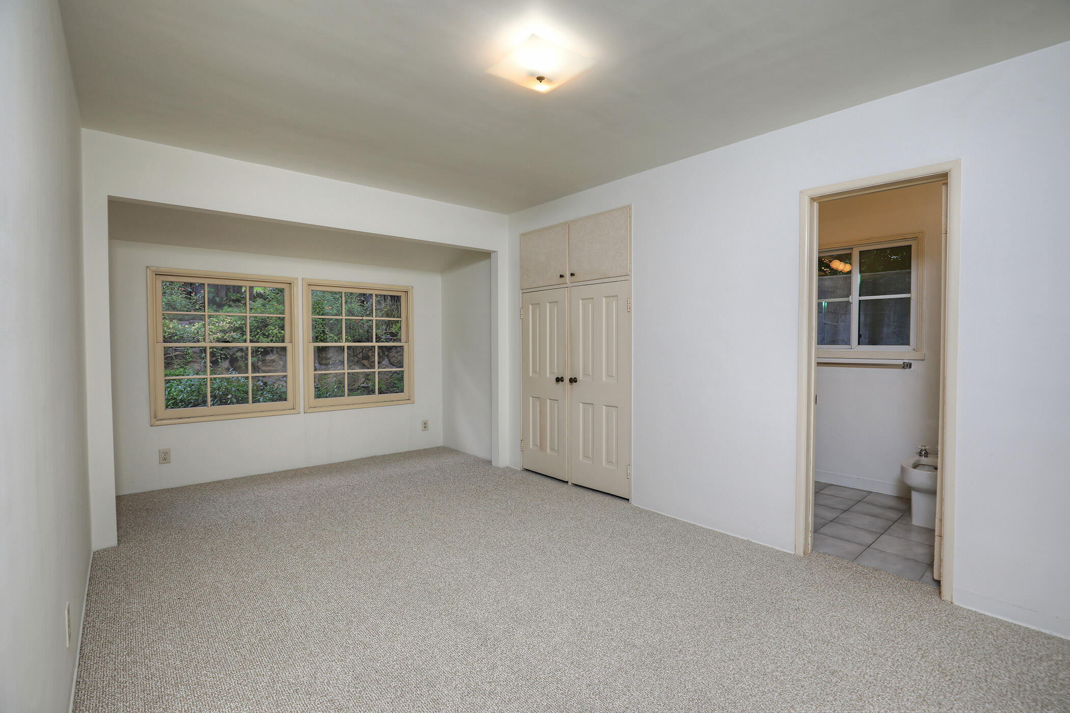 1712 Lasuen Road Santa Barbara, CA 93103 - Photo 12 of 38 an empty room with windows
