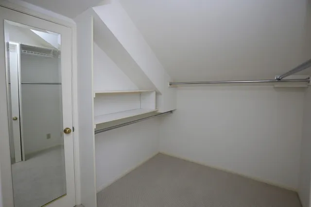 a bathroom with a toilet a sink and a mirror